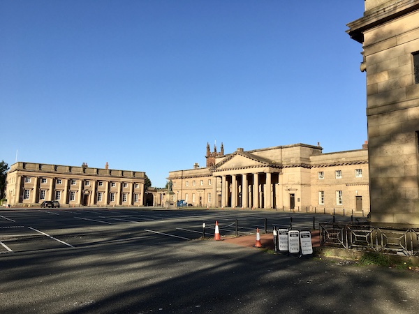The outer ward of the castle with a view of the Crown Court in centre which was built in 1801. The building to the left was a barracks.