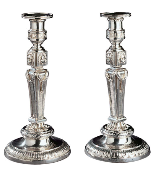 Pair of 'Lyon-faced' candlesticks housed at Grosvenor Museum, Chester.