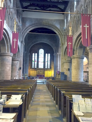 Looking towards the East wall and main altar of St. John's. What was a long sweep of Norman arches has since been cut short by the east and west walls.