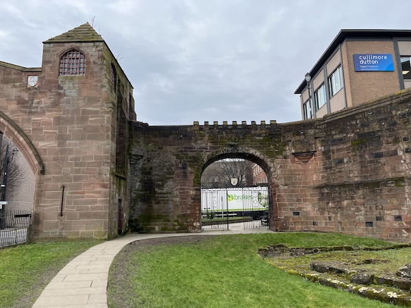 A view of the Wolfgate from outside the City Walls. The Newgate is on the left and the remains of a Roman Angle Tower are on the right.